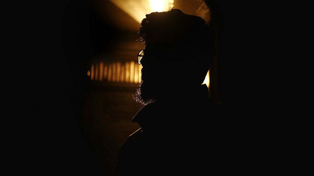 mysterious man in shadows