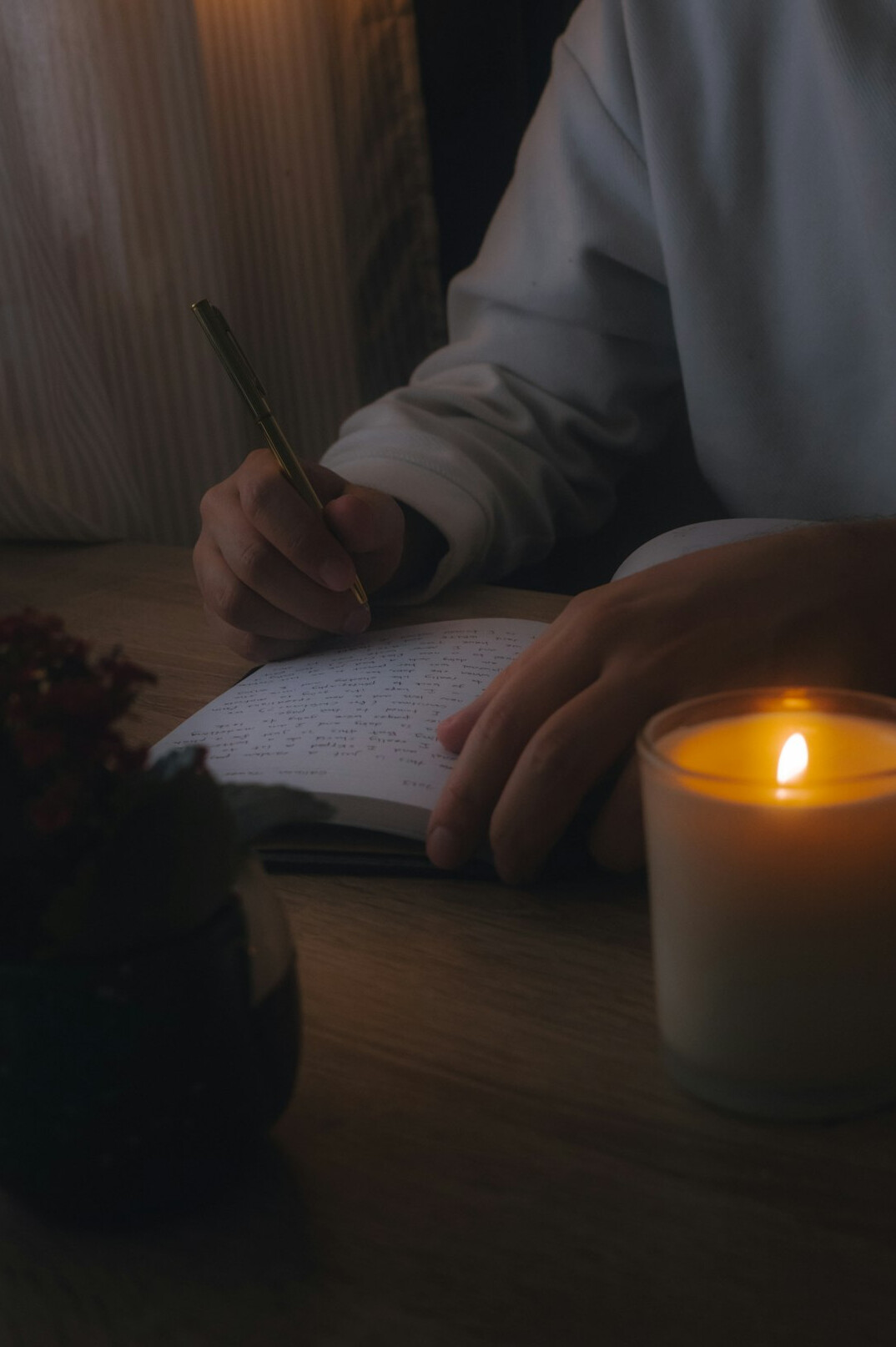 writer editing manuscript at night