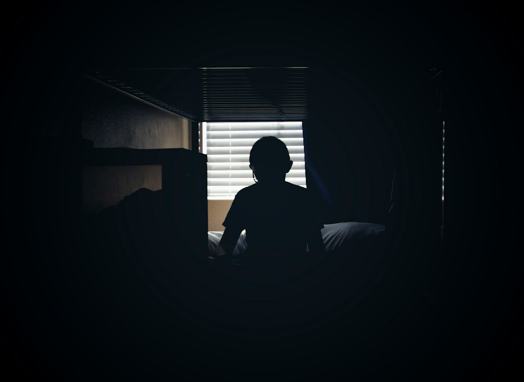 mysterious man in shadows