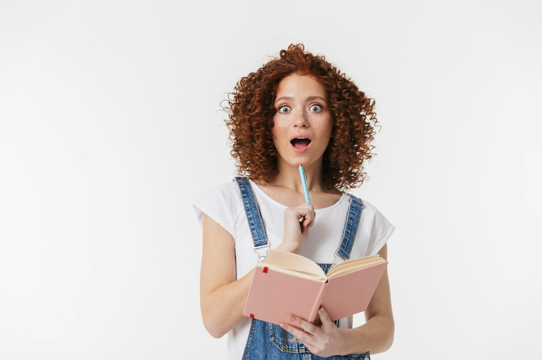 surprised person reading book